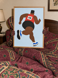 Big Red — framed print held by an Amalfi-patterned camouflaged figure in a bedroom