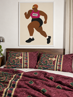 Run Auntie D Run in a white frame above a walnut bed with Amalfi Burgundy bedding